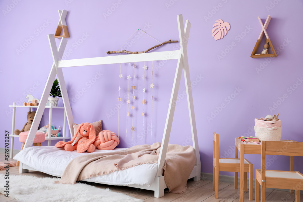 Interior of modern children's room with comfortable bed