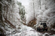 Off road car in snowy forest
