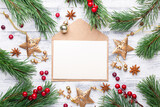Fototapeta Nowy Jork - Christmas composition with envelope and gifts on wooden background. Top view, copy space