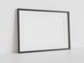 Black frame leaning on white floor in interior mockup. Template of a picture framed on a wall 3D rendering