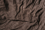 Fototapeta Desenie - Brown crumpled natural linen cloth texture as background.
