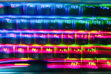 Wall Mural - Rainbow stripes, RGB keyboard lubricated. Red, yellow, blue stripes. The effect of floating colored letters in bright colors.