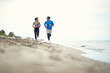 © luckybusiness - Young female boxer and her coach jogging on the beach