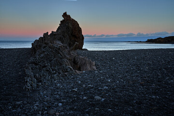 beautiful sunrise at Djúpalónssandur beach with its mound of rocks eroded by sea water on the island of iceland