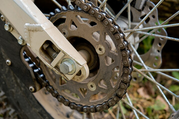 Dirty motorcycle chain. Close-up. Selective focus.