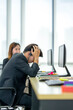 © thebigland45 - Asian Businessman are stressed while overtime working. Serious and tired working, Upset tired man, office employee lying on table, dozing off exhausted bored.