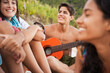 © SuperStock - Friends relaxing together on beach