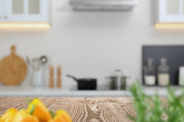 Wooden table in light kitchen. Space for design