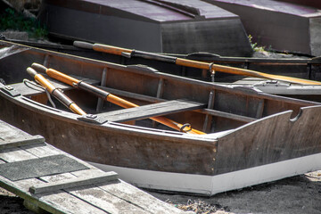 Wall Mural - Wooden rowboat on a beach near the ocean