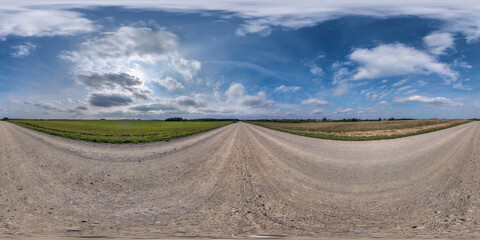 Wall Mural - full spherical seamless hdri panorama 360 degrees angle view on no traffic sand gravel road among fi
