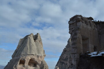 Another hilltop view of the fairy chimneys and historical caves in Cappadocia. Cappadocia from the top on a snowy winter day. 