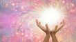 Healing is a magical experience  - female hands with with white light and a flow of sparkles against a pale rainbow coloured background with room for messages
