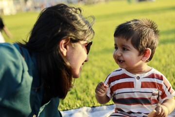 Mother with his one year old son happy candid moment