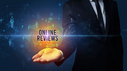 Elegant hand holding ONLINE REVIEWS inscription, social networking concept