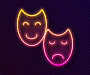 Wall Mural - Glowing neon line Comedy and tragedy theatrical masks icon isolated on black background. Vector.