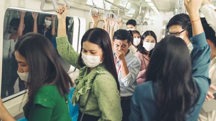 Sick man on train cough and make other people feel worry about virus spreading . Coronavirus COVID 19 pandemic and public transportation trouble concept .