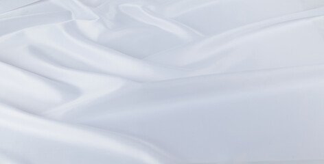 Closeup of white folded silk fabric for background