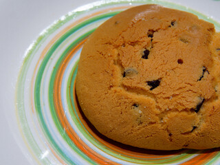 Breakfast with homemade typical Italian products. A baked biscuits with sugar on the top and chocolate chips.