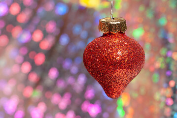 Christmas red pinecone on a shiny background