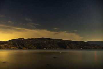 Wall Mural - starry sky seen from the shore of Okanagan lake at night british columbia Canada