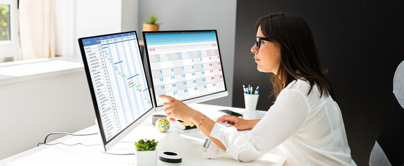 Employee Working On Calendar Schedule