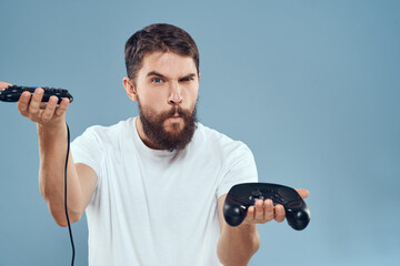 Cheerful man with joysticks in hands lifestyle leisure blue background