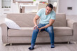 © Elnur - Injured young man suffering at home