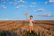 © Ilnur - Happy child running with toy airplane on sky background happy family Concept. Childhood dream.