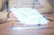 © peshkova - Double exposure of writing hand on background with data technology hologram. Big data concept.