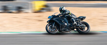 Motorcycle Racer Rides On A Sports Track