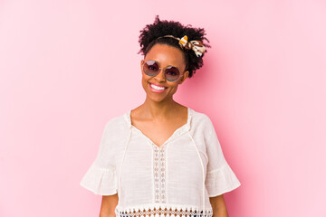 Wall Mural - Young african american hipster woman isolated happy, smiling and cheerful.