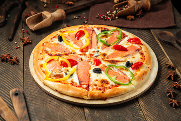 Wall Mural - Side view on pizza with salmon and bell pepper