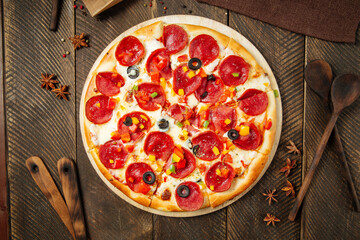 Wall Mural - Pepperoni pizza with bell pepper and salami 