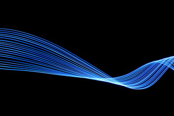 Wall Mural - Long exposure photograph of neon blue colour in an abstract swirl, parallel lines pattern against a black background. Light painting photography.