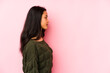 © Asier - Young chinese woman isolated on a pink background gazing left, sideways pose.