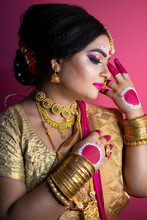 Bridal Portrait Of Indian Lady Wearing Traditional Saree And Gold Jewellery