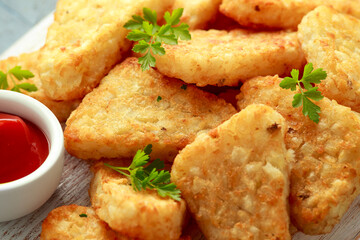 Wall Mural - Hash brown potato with ketchup on white wooden board