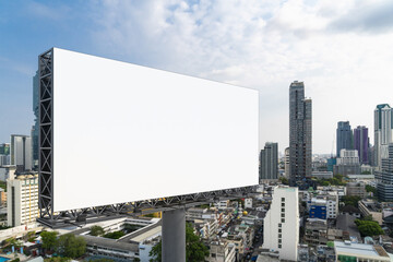 Blank white road billboard with Bangkok cityscape background at day time. Street advertising poster, mock up, 3D rendering. Side view. The concept of marketing communication to promote or sell idea.