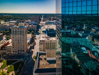 Wall Mural - Aerial view of downtown Lexington, Kentucky partially blocked by blue glass reflective surface of high rise office building