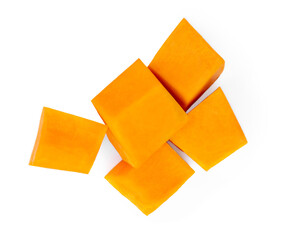 Pumpkin pieces cut in a cube slices isolated on white background. Diced Pumpkin