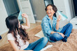 © shevchukandrey - Two kids having fun at home with origami planes