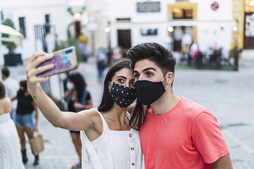 Sticker - Closeup shot of a happy couple taking a selfie on the street