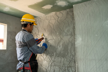 Fototapete - Electrician working with switches and sockets of a residential electrical system.