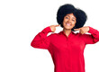© Krakenimages.com - Young african american girl wearing casual clothes smiling cheerful showing and pointing with fingers teeth and mouth. dental health concept.
