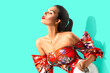 © Subbotina Anna - Beauty fashion model girl in trendy wear, with bright make-up, brunette woman over blue background posing. Street Fashion look. Beautiful young brunette woman with trendy accessories