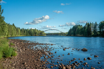 Canvas Print - Summer view of an Arch bridge crossing the east Dal-river in Sweden