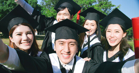 Wall Mural - group happy graduates students