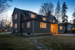 Real estate photography - exterior of single family house during twilight hours in Montreal's suburb