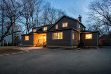Real Estate Photography - Exterior Of Single Family House During Twilight Hours In Montreal's Suburb