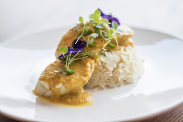 Wall Mural - steamed fish on rice with thermidor sauce.